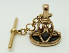 An 18ct gold T-bar and an 18ct fob set with blood stone, 12.