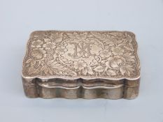 An Edward VII hallmarked silver snuff box with shaped edge and gilt interior,