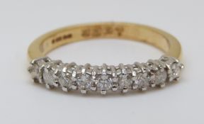 An 18ct gold half eternity ring set with diamonds totalling approximately 0.33ct, 3.