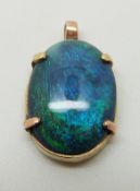 A 9ct gold pendant set with a black opal cabochon, 2.