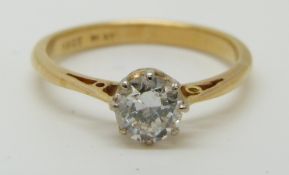 An 18ct gold ring set with a diamond of approximately 0.