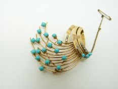 A Persian yellow metal brooch set with turquoise cabochons and diamonds, 4.