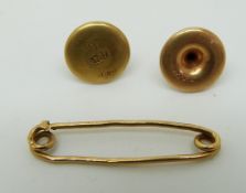 Two 18ct gold studs and a 9ct gold pin