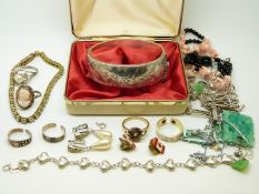 A silver bangle, four silver necklaces, three silver bracelets,