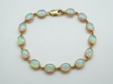 A 9ct gold bracelet set with oval opals