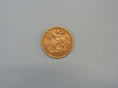 A 1900 gold half sovereign.