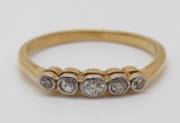 An 18ct gold ring set with five diamonds, 2.