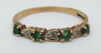 A 9ct gold ring set with emeralds and diamonds (size O)