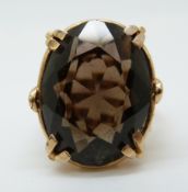 A 9ct gold ring set with a large smoky quartz (size I)