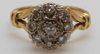 An 18ct gold ring set with diamonds in a cluster,