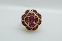 A 9ct gold ring set with synthetic rubies in a large cluster, 5.
