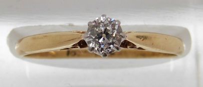 An 18ct gold ring set with an old cut diamond of approximately 0.