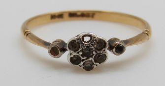 A 9ct gold ring set with diamonds in a flower cluster, 1.