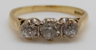 An 18ct gold ring set with three diamonds, total diamond weight approximately 0.