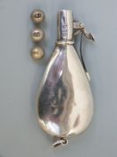 A George V hallmarked silver novelty shooting butt marker formed as a shot or powder flask,