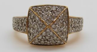 An 18ct gold ring set with diamonds in a large square cluster, total diamond weight approximately 0.