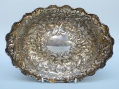 A Victorian hallmarked silver repoussé decorated oval bowl, London 1896,
