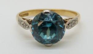 An 18ct white gold ring set with a zircon with diamonds to the shoulders in a platinum setting