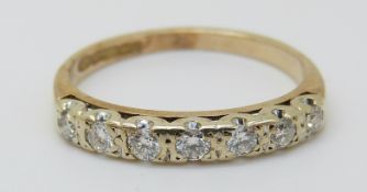 A 9ct gold rings set with seven diamonds, 1.