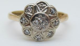 An 18ct gold ring set with diamonds in a cluster, 3.