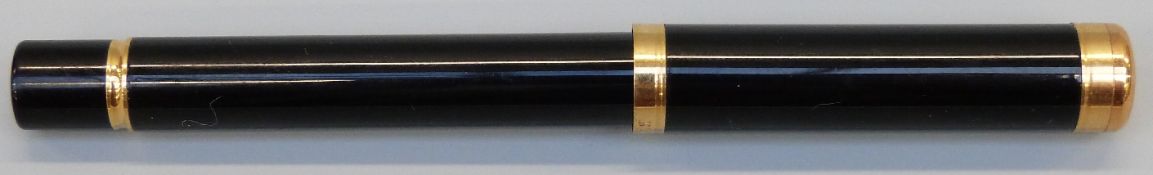A small Waterman fountain pen with 18k gold nib and black body