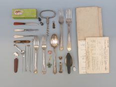Hallmarked silver cutlery with English and continental marks, a corkscrew, hat pins, badges,