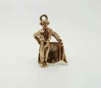 A 9ct gold charm in the form of a bull fighter, 2.