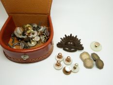 A pair of silver cufflinks, an Australian Commonwealth cat badge,