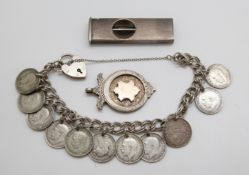 A silver cigar cutter,