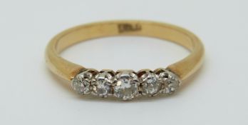 An 18ct gold ring set with five diamonds, 2.
