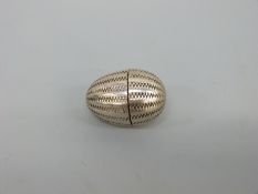 An early 18thC white metal pomander or spice holder of ovoid form with two screw sections and gilt
