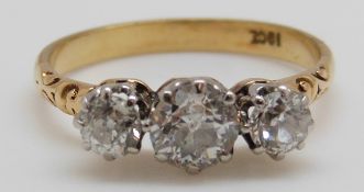 An 18ct gold Victorian ring set with three old English cut diamonds,