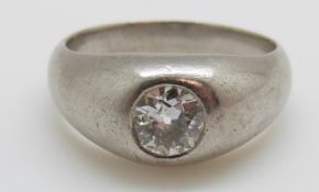 A platinum ring set with an old cut diamond of approximately 0.