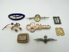 A Victorian mourning brooch, gold plated 21 key brooch, silver brooch, RAF brooch,