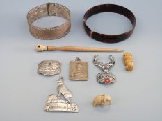 A sterling silver bangle with Greek key design, ivory items,