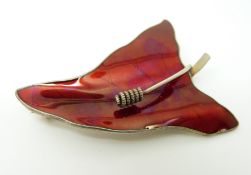 A Norwegian silver brooch set with red enamel in a leaf decoration 5.5 x 3.