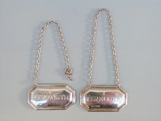 A pair of hallmarked silver bottle tickets for I Vermouth and F Vermouth,