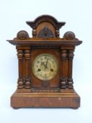 A two train mantel clock in classical design case with Roman ivory coloured chapter ring and gilt