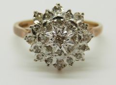 A 9ct gold ring set with diamonds in a cluster, 3.