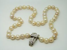 A single strand cultured pearl necklace with 18ct white gold clasp set with diamonds