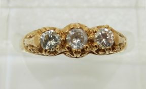 An 18ct gold ring set with three diamonds, 4.