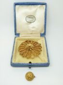 A gilt filigree brooch and a Victorian pinchbeck brooch, 4.