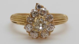 An 18ct gold Victorian ring set with old cut diamonds in the form of a heart,