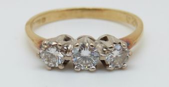 An 18ct gold ring set with three diamonds, total diamond weight approx 0.