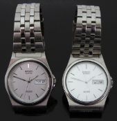 Two Seiko SQ100 stainless steel gentleman's wristwatches both with day and date apertures and two