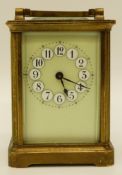 A mid 20thC brass cased carriage clock in corniche style case,