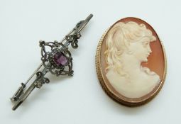 A 9ct gold brooch set with a cameo and a silver brooch