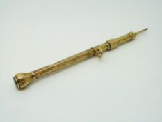 A Victorian propelling pencil set with agate to the top and chased decoration