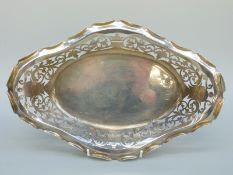 A hallmarked silver pierced boat shaped dish or bowl, marks rubbed, length 31cm,
