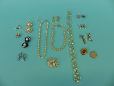 A collection of costume jewellery including Trifari earrings, Trifari brooch,